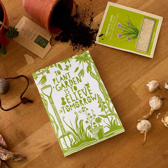 'To plant a garden' quote notebook product photo default L